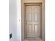 The home's front door with sidelights and a dark metallic handle and deadbolt at 2640 Suncoast Lakes Blvd, Punta Gorda, FL 33980