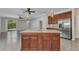 Kitchen island with stone countertops, stainless steel appliances and lots of storage space at 2640 Suncoast Lakes Blvd, Punta Gorda, FL 33980