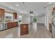 Bright kitchen flowing into a spacious living area with natural light at 2640 Suncoast Lakes Blvd, Punta Gorda, FL 33980