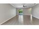 Bright living room featuring tile floors and slider door at 2640 Suncoast Lakes Blvd, Punta Gorda, FL 33980