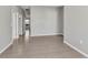 Spacious living room with wood-look tile flooring and neutral paint at 2640 Suncoast Lakes Blvd, Punta Gorda, FL 33980