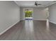 Bright living room with tiled floors and sliding glass doors leading to the outdoor area, creating a seamless indoor-outdoor flow at 2640 Suncoast Lakes Blvd, Punta Gorda, FL 33980