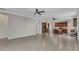 Open-concept living room with tile floors, and kitchen with stainless steel appliances at 2640 Suncoast Lakes Blvd, Punta Gorda, FL 33980