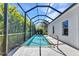 A private in-ground screened pool with a deck surrounded by lush landscaping for ultimate outdoor relaxation at 2640 Suncoast Lakes Blvd, Punta Gorda, FL 33980