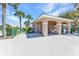 Charming pool house with a covered seating area, providing a perfect spot for shade and relaxation at 2640 Suncoast Lakes Blvd, Punta Gorda, FL 33980