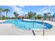 Inviting community pool with clear water and a convenient entry with seating, ideal for leisurely swims at 2640 Suncoast Lakes Blvd, Punta Gorda, FL 33980
