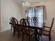 Formal dining room features a chandelier and seating for six at 675 Hartford Heights St, Spring Hill, FL 34609