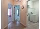 Hallway offering access to bedroom and laundry room with tiled floor at 675 Hartford Heights St, Spring Hill, FL 34609