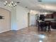 Open concept living space featuring tile flooring and an open archway at 675 Hartford Heights St, Spring Hill, FL 34609