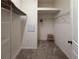 Walk-in closet with wire shelving and carpeted floor and step stool at 675 Hartford Heights St, Spring Hill, FL 34609