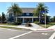 Charming new clubhouse exterior features a landscaped entrance and inviting covered porch for social gatherings at 14552 Skipping Stone Loop, Parrish, FL 34219
