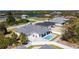 Aerial view of home with a pool in a well maintained suburban neighborhood at 159 Antilla Dr, Rotonda West, FL 33947