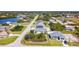 Aerial view of a suburban neighborhood in a tropical environment at 159 Antilla Dr, Rotonda West, FL 33947