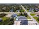 Aerial view of a home and neighborhood with many trees and greenery at 159 Antilla Dr, Rotonda West, FL 33947