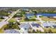 Aerial view of a neighborhood with ponds and many manicured lawns at 159 Antilla Dr, Rotonda West, FL 33947
