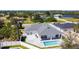 Aerial view of a home with a pool in a suburban neighborhood at 159 Antilla Dr, Rotonda West, FL 33947