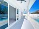 Covered patio with ceiling fans overlooking pool, accessible via sliding glass doors at 159 Antilla Dr, Rotonda West, FL 33947