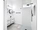 Modern bathroom featuring dual vanities, square shower head and contemporary fixtures at 159 Antilla Dr, Rotonda West, FL 33947