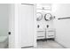 Modern bathroom with double sinks, round mirrors, and stylish black fixtures at 159 Antilla Dr, Rotonda West, FL 33947