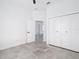 Bright, minimalist bedroom features a view into another room at 159 Antilla Dr, Rotonda West, FL 33947