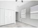 A bedroom featuring a closet, door, and windows for ample natural light at 159 Antilla Dr, Rotonda West, FL 33947