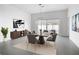 Modern dining room with contemporary light fixture and access to outdoor space at 159 Antilla Dr, Rotonda West, FL 33947