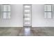 Bright entryway with large windows flanking the front door and modern tile flooring at 159 Antilla Dr, Rotonda West, FL 33947