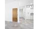 Bright hallway with white cabinets and drawers on the right and an open doorway on the left at 159 Antilla Dr, Rotonda West, FL 33947