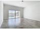 Bright living room with sliding glass doors leading to a backyard swimming pool at 159 Antilla Dr, Rotonda West, FL 33947