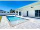 Beautiful backyard pool and patio area with an in-ground pool and modern patio at 159 Antilla Dr, Rotonda West, FL 33947