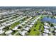 Scenic aerial view of a vibrant residential community with lush landscaping and a tranquil lake at 6522 11Th W Ave, Bradenton, FL 34209