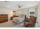 Cozy bedroom with ceiling fan, and neutral walls for a bright and relaxing atmosphere at 6522 11Th W Ave, Bradenton, FL 34209