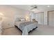 Bright and airy bedroom with large closet, ceiling fan, and neutral color scheme at 6522 11Th W Ave, Bradenton, FL 34209
