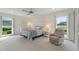 Bedroom featuring a large window and neutral color scheme creating a relaxing atmosphere at 6522 11Th W Ave, Bradenton, FL 34209