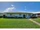 Well-maintained home with lush green lawn and inviting curb appeal at 6522 11Th W Ave, Bradenton, FL 34209