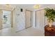 Bright foyer with tiled floors, white doors, and a decorative table, inviting guests into a well-maintained home at 6522 11Th W Ave, Bradenton, FL 34209