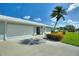 Quaint one-story home with a two-car garage, neat landscaping, and tiled roof offering a blend of comfort and style at 6522 11Th W Ave, Bradenton, FL 34209