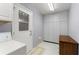 Laundry area with washer and storage cabinets, providing functionality and organization at 6522 11Th W Ave, Bradenton, FL 34209