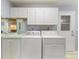 Convenient laundry room with washer, dryer, and ample cabinet space at 6522 11Th W Ave, Bradenton, FL 34209