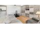 Relaxing living room with neutral tones, built-in shelving, and seamless access to the laundry area at 6522 11Th W Ave, Bradenton, FL 34209