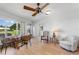 Bright living room features wood floors, large windows, and comfortable seating areas at 6522 11Th W Ave, Bradenton, FL 34209