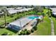 A community pool and pool house, surrounded by manicured landscaping, provides a refreshing recreational space at 6522 11Th W Ave, Bradenton, FL 34209