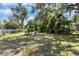 Backyard with large shade trees and room to enjoy the outdoors at 1724 Harbor Dr, Clearwater, FL 33755