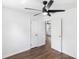 Bright bedroom features hardwood floors, ceiling fan, and attached bath at 1724 Harbor Dr, Clearwater, FL 33755
