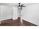 Well-lit bedroom features hardwood floors and a ceiling fan at 1724 Harbor Dr, Clearwater, FL 33755