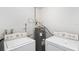 Laundry area with standard washer and dryer hookups and water heater at 1724 Harbor Dr, Clearwater, FL 33755