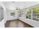 Bright living room with beautiful hardwood floors and large windows at 1724 Harbor Dr, Clearwater, FL 33755