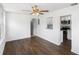 Open living space with hardwood floors leading to a renovated kitchen at 1724 Harbor Dr, Clearwater, FL 33755
