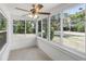 Cozy sunroom with tile floors and lots of windows for natural light at 1724 Harbor Dr, Clearwater, FL 33755