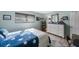 Sunlit bedroom featuring nautical themed décor, a bright window, and a white dresser at 5501 80Th N St # 201, St Petersburg, FL 33709